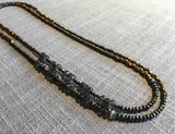 top view of gemstone bead necklace comprising grey moonstone, bronze and dark grey pyrite