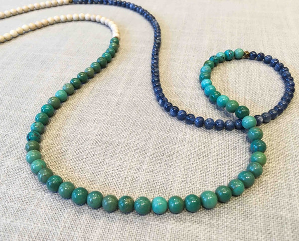 closeup of gemstone bead necklace comprising turquoise, fossil jasper and blue kyanite