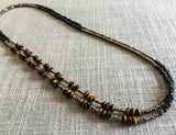 top view of gemstone bead necklace comprising brown tigers eye, dark bronze and golden pyrite