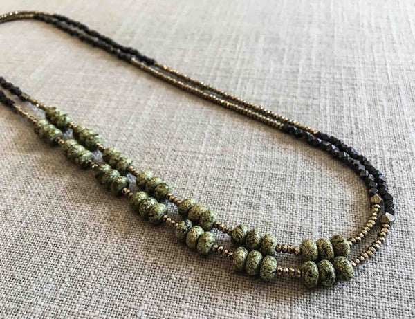 top view of gemstone bead necklace comprising green moss agate, dark bronze and golden pyrite