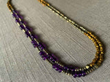 top view of gemstone bead necklace comprising purple amethyst, bronze and dark grey pyrite