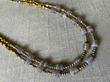 side view of gemstone bead necklace comprising grey moonstone, bronze and dark grey pyrite