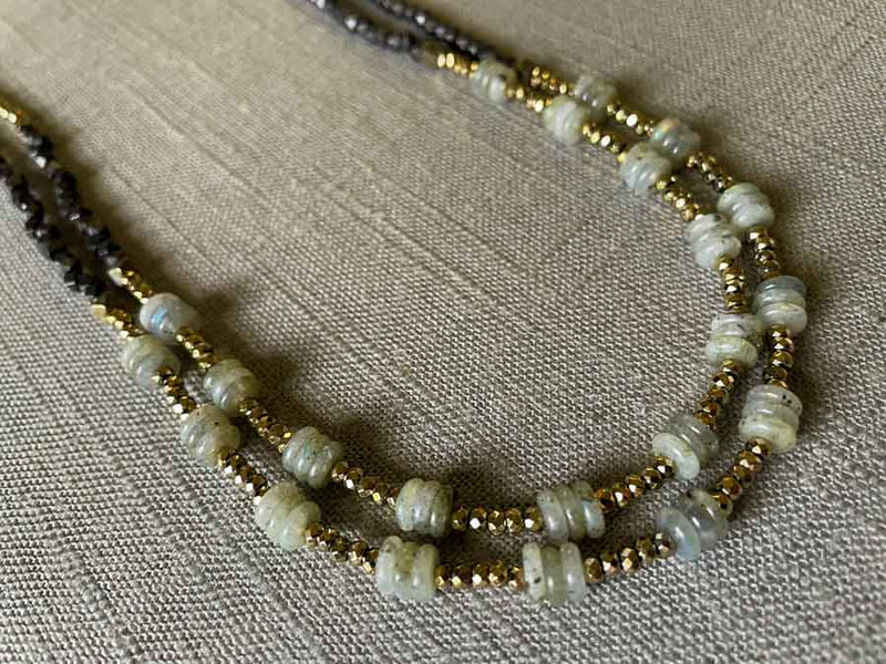 side view of gemstone bead necklace comprising grey labradorite, dark bronze and golden pyrite