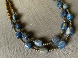 side view of gemstone bead necklace comprising blue kyanite, bronze and dark grey pyrite