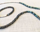 closeup of gemstone bead necklace comprising fossil jasper, green labradorite and green apatite  Edit alt text