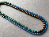 top view of gemstone bead necklace comprising blue apatite, green aventurine and exotic wood