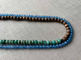 side view of gemstone bead necklace comprising blue apatite, green aventurine and exotic wood