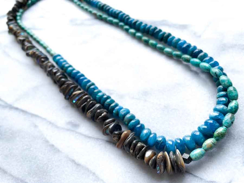 top view of gemstone bead necklace comprising turquoise, blue apatite and Tahitian shell