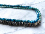 side view of gemstone bead necklace comprising turquoise, blue apatite and Tahitian shell