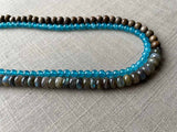 side view of gemstone bead necklace comprising blue apatite, blue labradorite and exotic wood