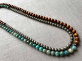 top view of gemstone bead necklace comprising blue chrysoprase, bronze and exotic wood