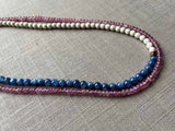 side view of gemstone bead necklace comprising blue kyanite, pink sapphire and white turquoise