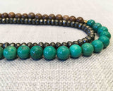 side view of gemstone bead necklace comprising turquoise, pyrite and exotic wood