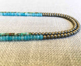 side view of gemstone bead necklace comprising blue chalcedony, light gold hematite and turquoise