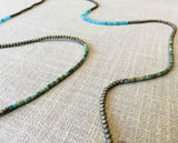 closeup of gemstone bead necklace comprising blue chalcedony, light gold hematite and turquoise