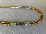 side view of gemstone bead necklace comprising labradorite, gold hematite and golden pyrite