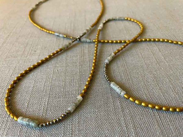 closeup of gemstone bead necklace comprising labradorite, gold hematite and golden pyrite