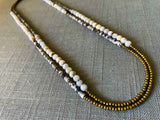 top view of gemstone bead necklace comprising black/white/nude feldspar, pink opal and gold hematite