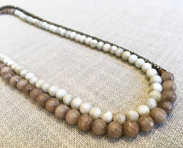 top view of gemstone bead necklace comprising taupe quartz, white siberian moonstone and dark grey pyrite