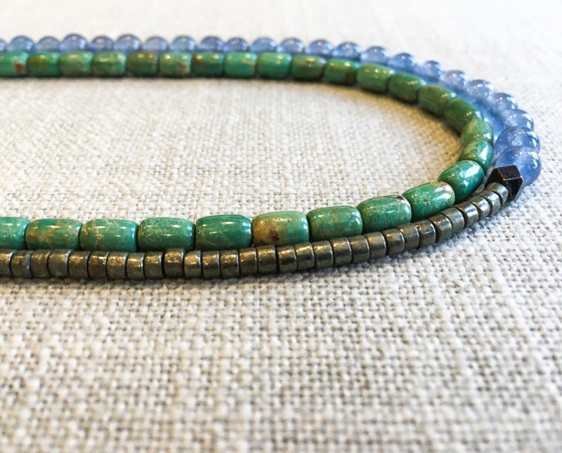 side view of gemstone bead necklace comprising blue apatite, turquoise and metallics