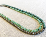 top view of gemstone bead necklace comprising blue chrysoprase, bronze hematite and sea foam moss agate