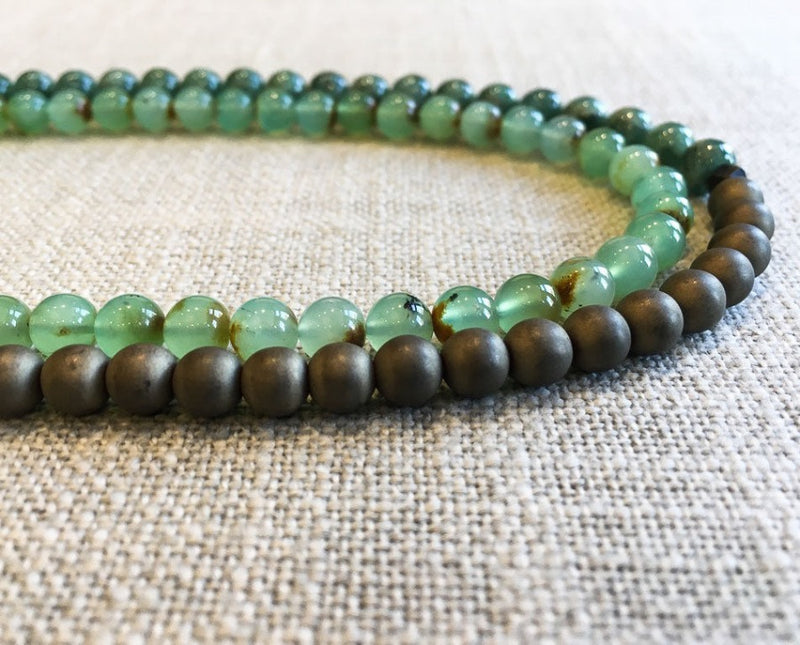 side view of gemstone bead necklace comprising blue chrysoprase, matte bronze and sea foam moss agate