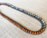 top view of gemstone bead necklace comprising grey landscape jasper, exotic wood and dark grey pyrite