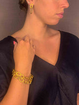 additional view of model wearing organic-shaped gold bracelet