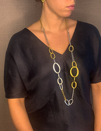 model wearing organic-shaped mixed necklace