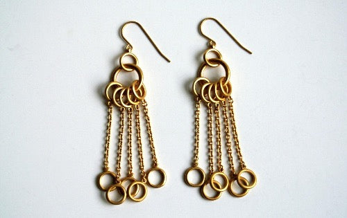 top view of organic-shaped gold earrings