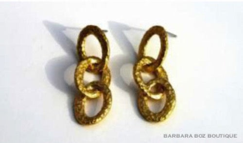 top view of organic-shaped gold earrings