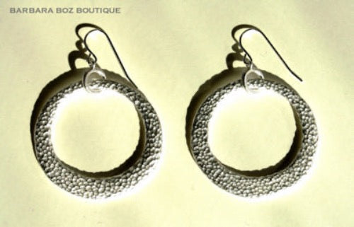 top view of organic-shaped silver earrings