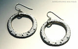 top view of organic-shaped silver earrings