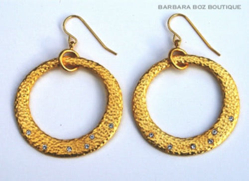 top view of organic-shaped gold earrings