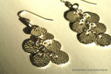 top view of organic-shaped silver earrings