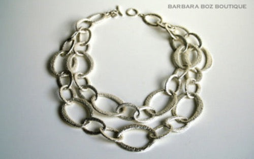 top view of organic-shaped silver necklace