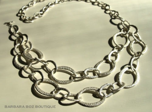 top view of organic-shaped silver necklace