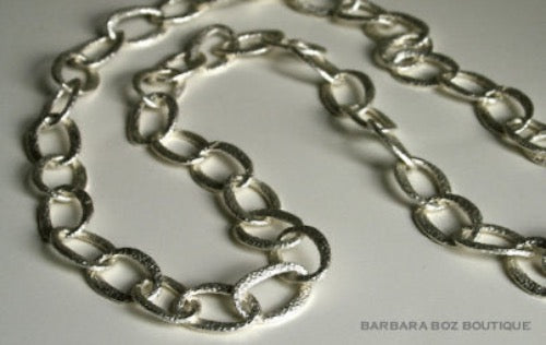 top view of organic-shaped silver necklace  