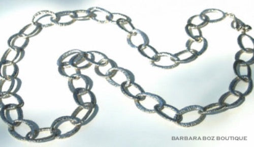 top view of organic-shaped silver necklace