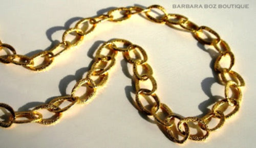 top view of organic-shaped gold necklace