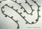 closeup of organic-shaped silver necklace