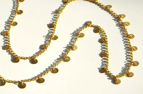 closeup of organic-shaped gold necklace