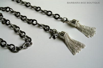 top view of organic-shaped silver tassels on necklace