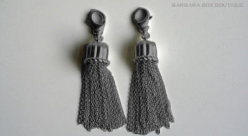 top view of organic-shaped silver tassels