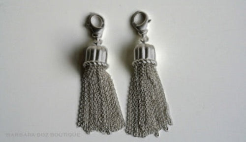 top view of organic-shaped silver tassels