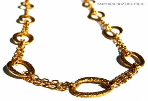 closeup of organic-shaped gold necklace