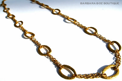 top view of organic-shaped gold necklace