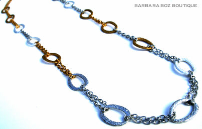 top view of organic-shaped gold and silver necklace