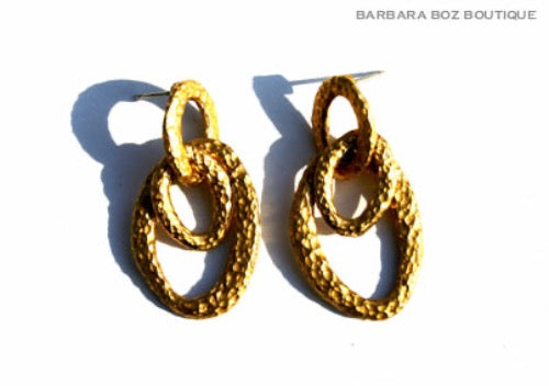 top view of organic-shaped gold earrings