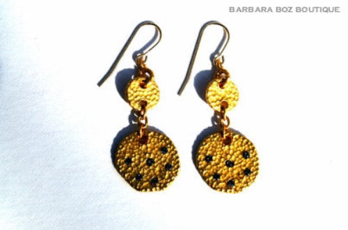 top view of organic-shaped gold earrings